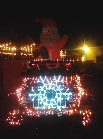 Santa on lighted jeep